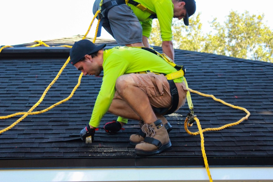 Reynolds Roofing installer nailing shingles during a roof replacement in Harrisburg, NC